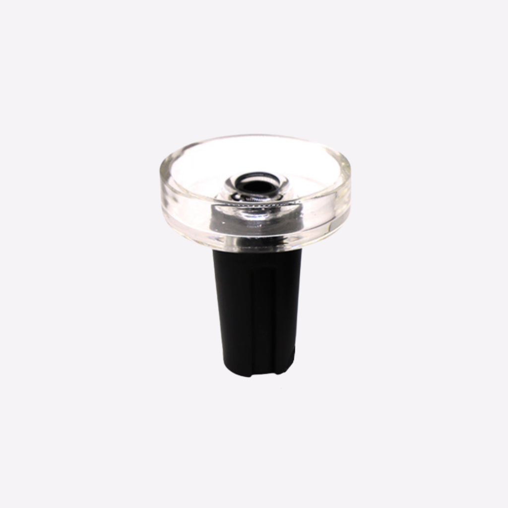 Clear glass component with black base on a white background bowl