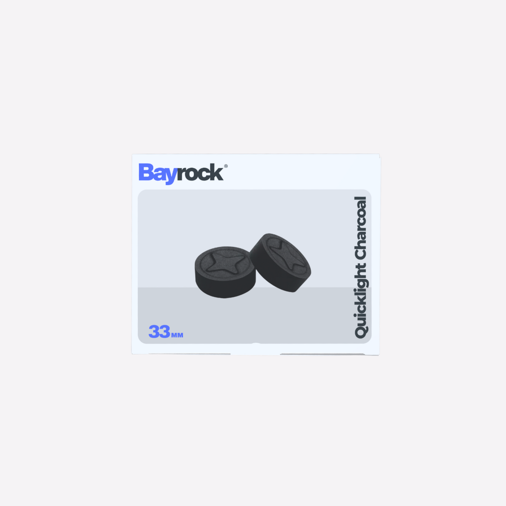 Two black Quicklight Charcoal tablets on a Bayrock branded card with a white background